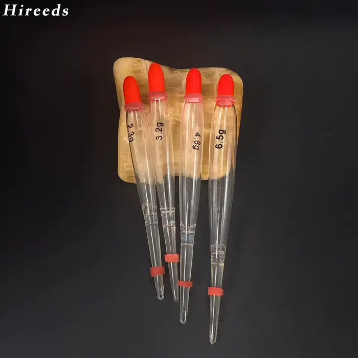 5 flotteurs de pêche à la mouche transparents à accents orange pour truite et saumon |